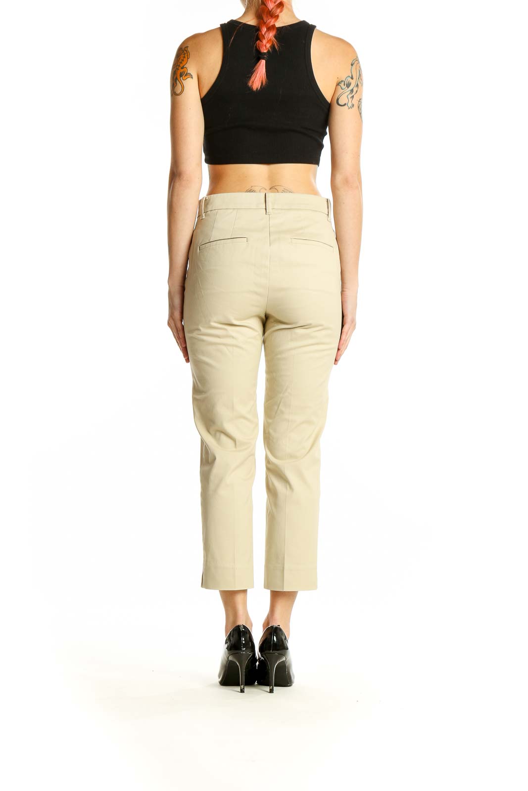 Side view of Ann Taylor beige cropped trousers on model with black top