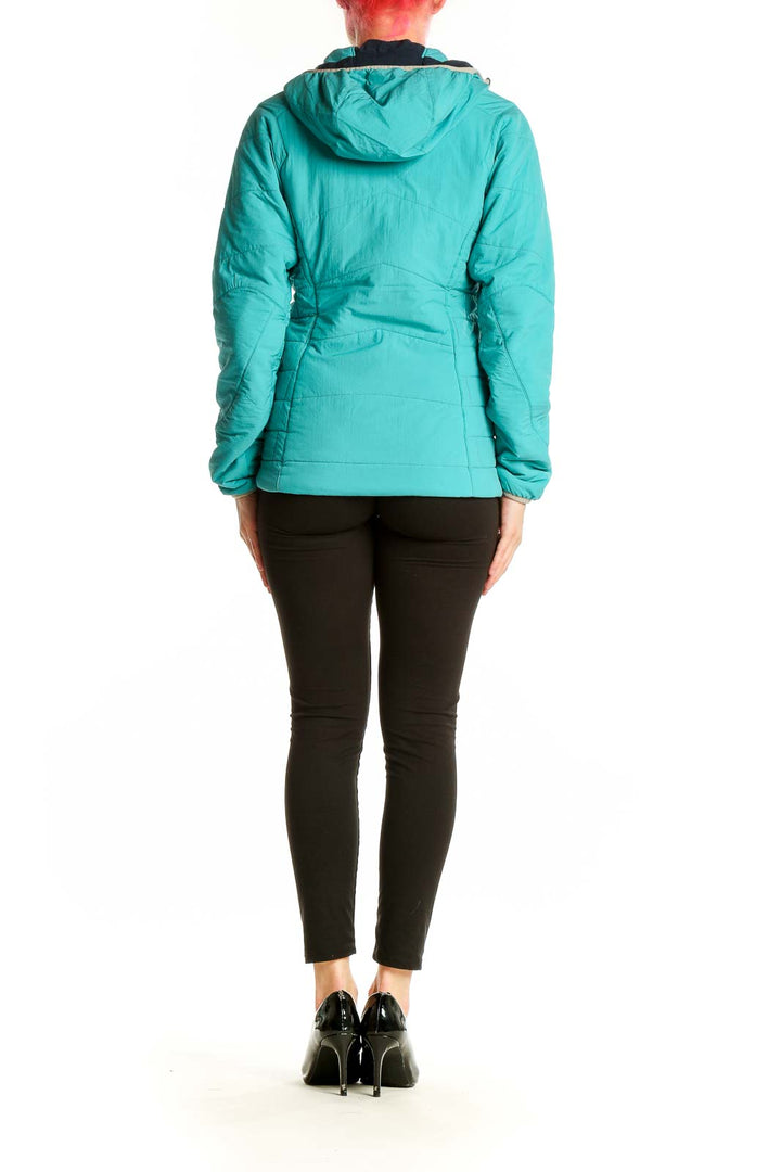 Side view of teal Patagonia hooded insulated jacket on model