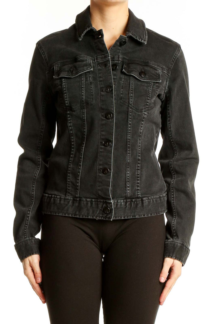 Front view of Calvin Klein black denim jacket on model