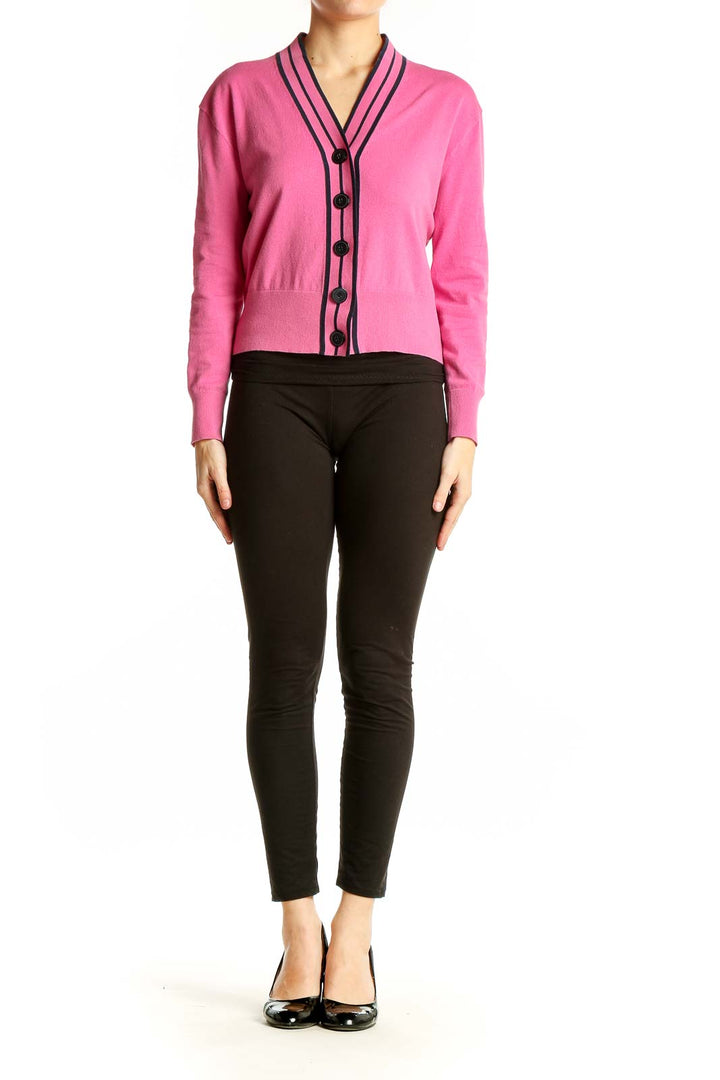 Front view of J.Crew pink cardigan with black striped trim and buttons