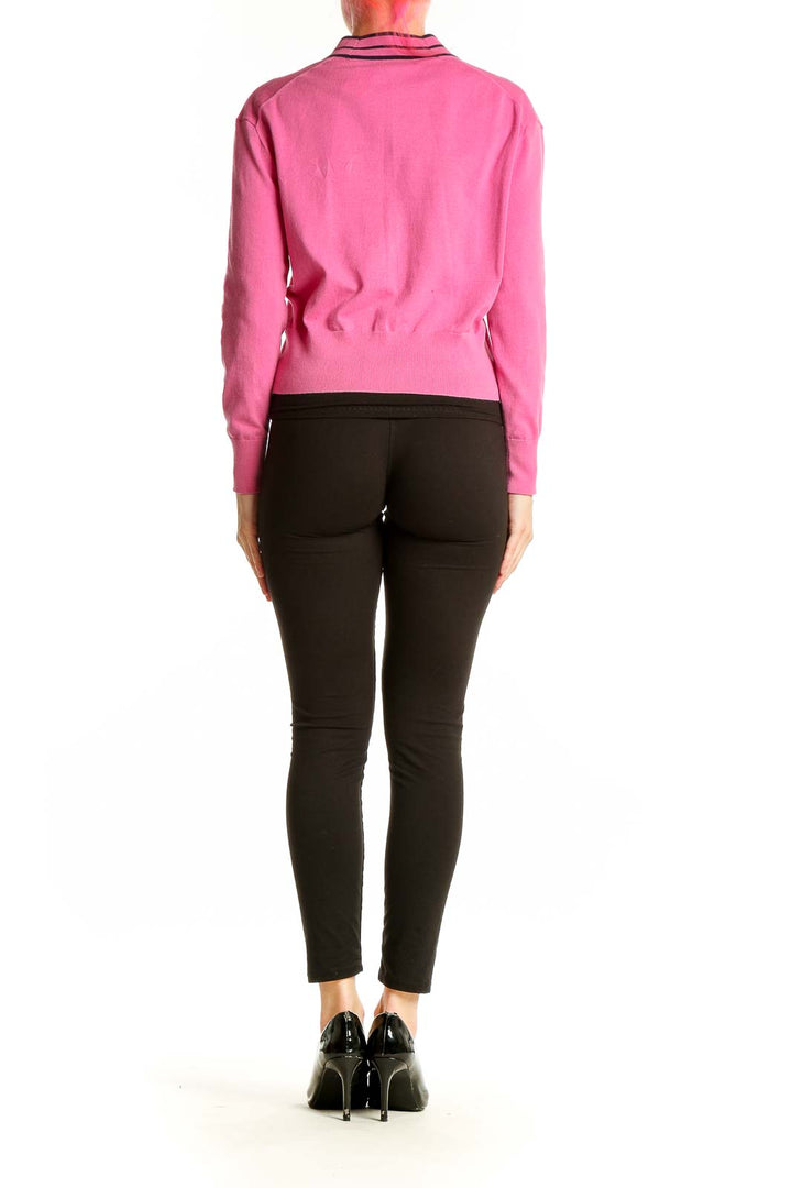 Side view of J.Crew pink cardigan showing V-neck and cropped length