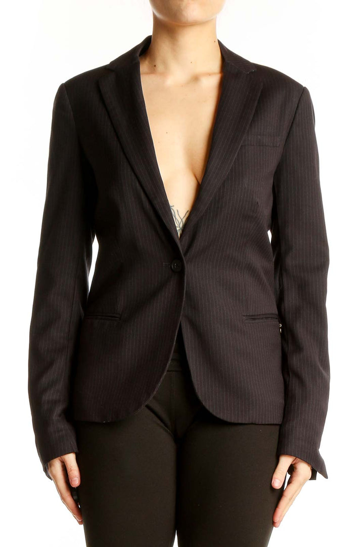 Front view of Maison Scotch black pinstriped blazer on model