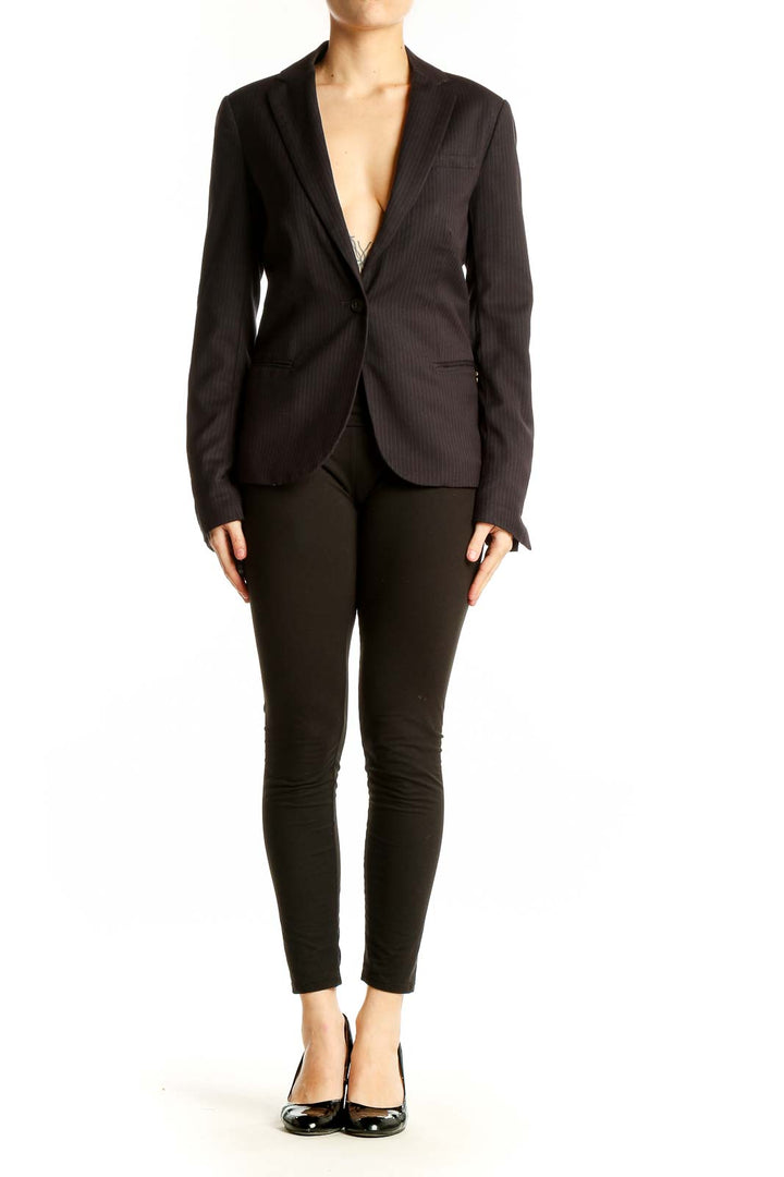 Front view of Maison Scotch black pinstriped blazer on model