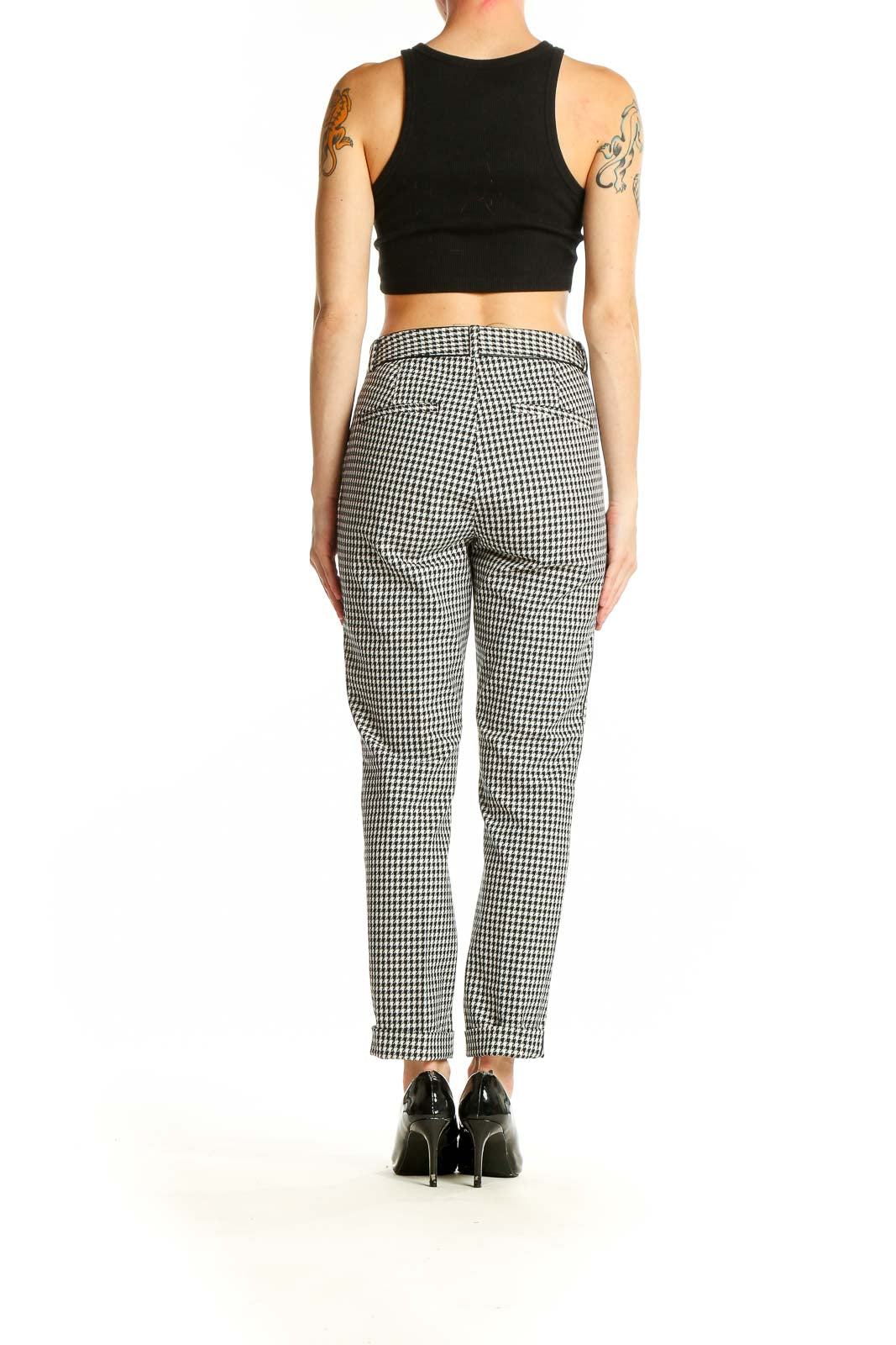 Side view of model wearing Banana Republic Black and White Gingham Check Trousers with black top