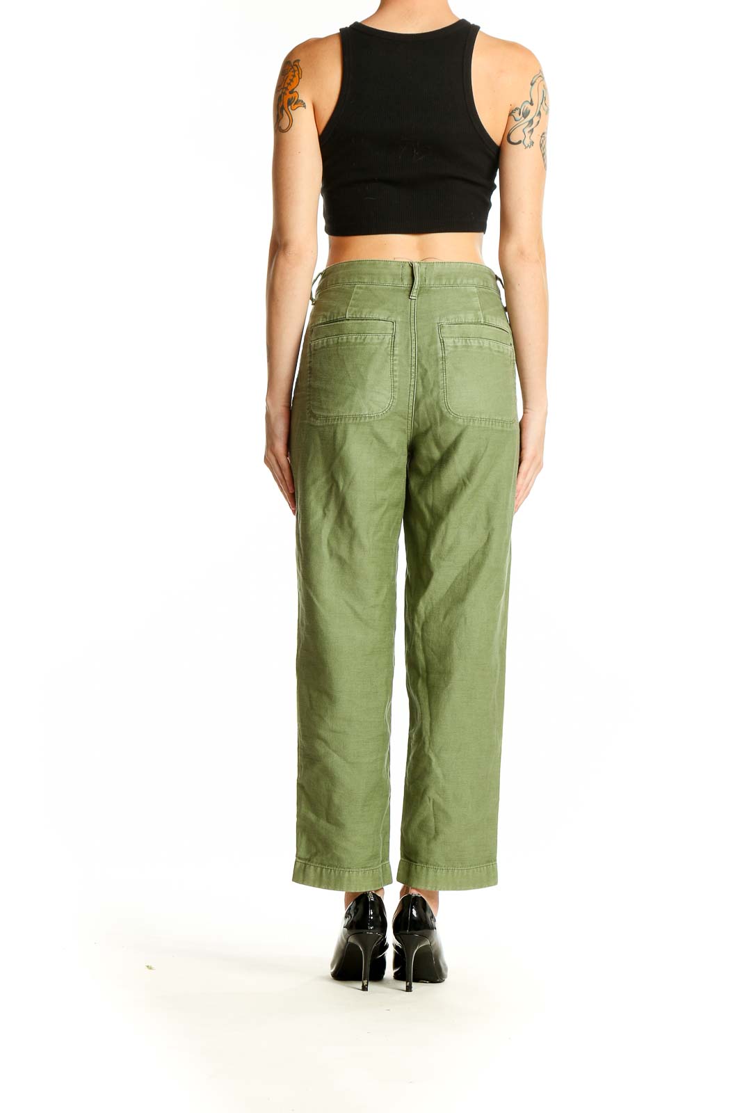 Side view of model wearing olive green J.Crew utility pants with black top