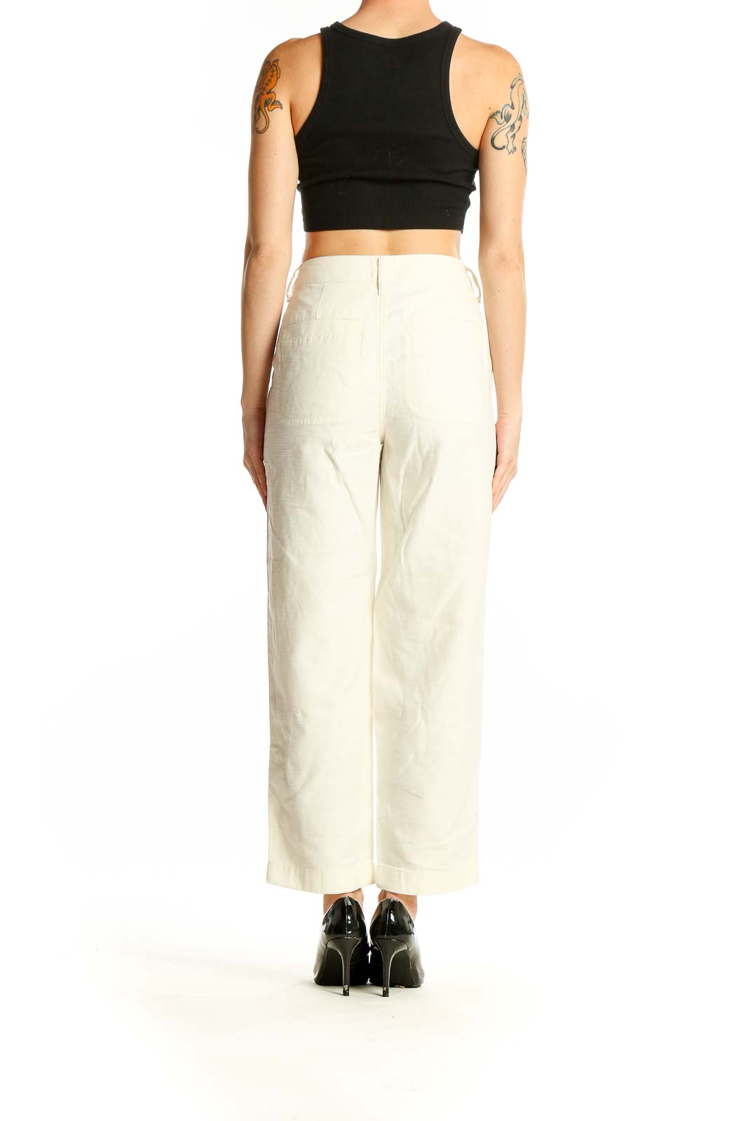 Side view of J.Crew cream cotton wide-leg trousers on model with black top