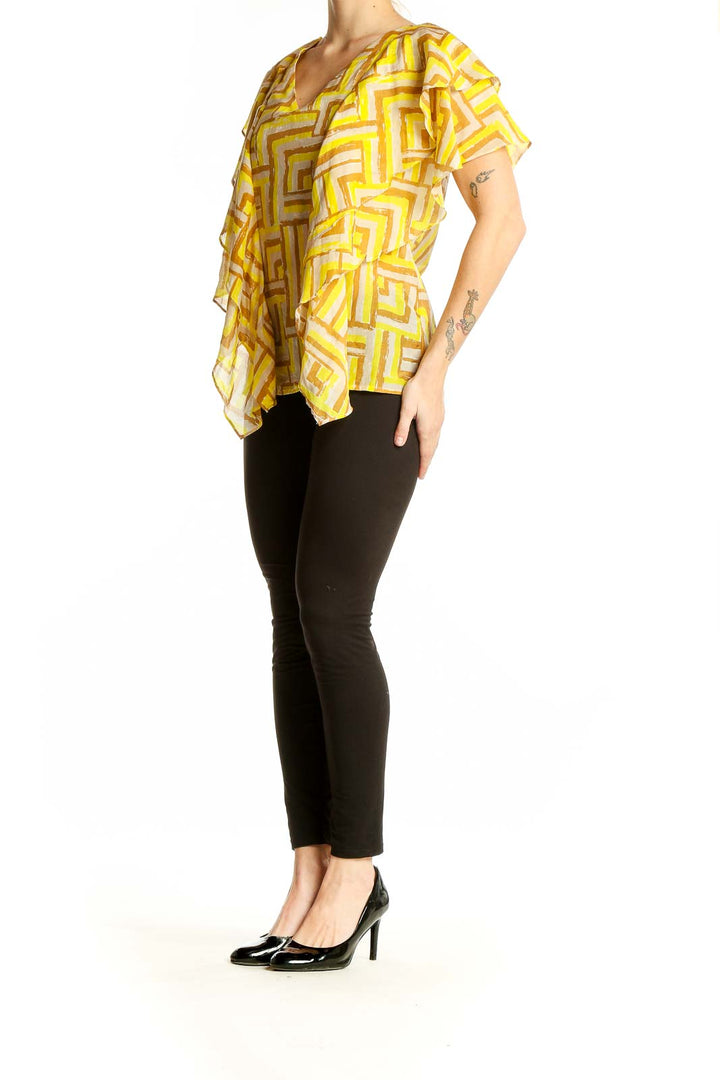 Front view of Sugarlips Yellow Geometric Print Ruffled Blouse with V-neckline