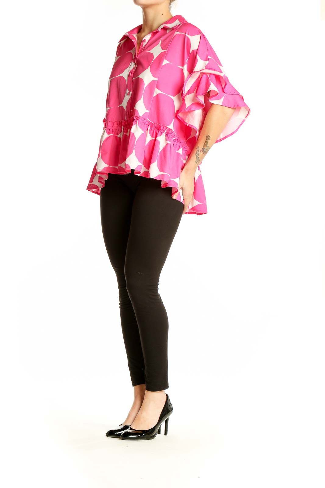 Front view of pink and white polka dot blouse with ruffled sleeves