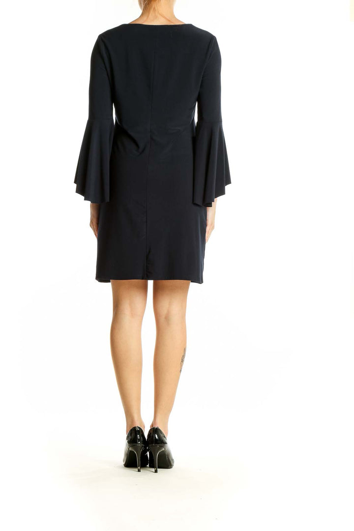 Side view of black Polo Ralph Lauren dress showing bell sleeve detail