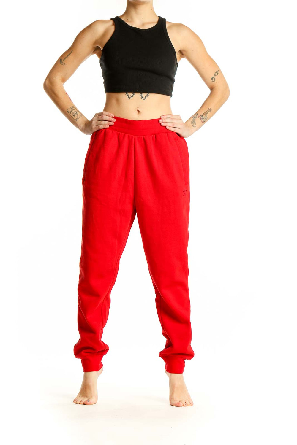 Front view of red Adidas cotton jogger sweatpants with elastic waistband