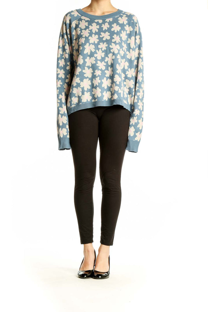 Front view of Spiritual Gangster blue floral knit sweater with cream-colored flower pattern