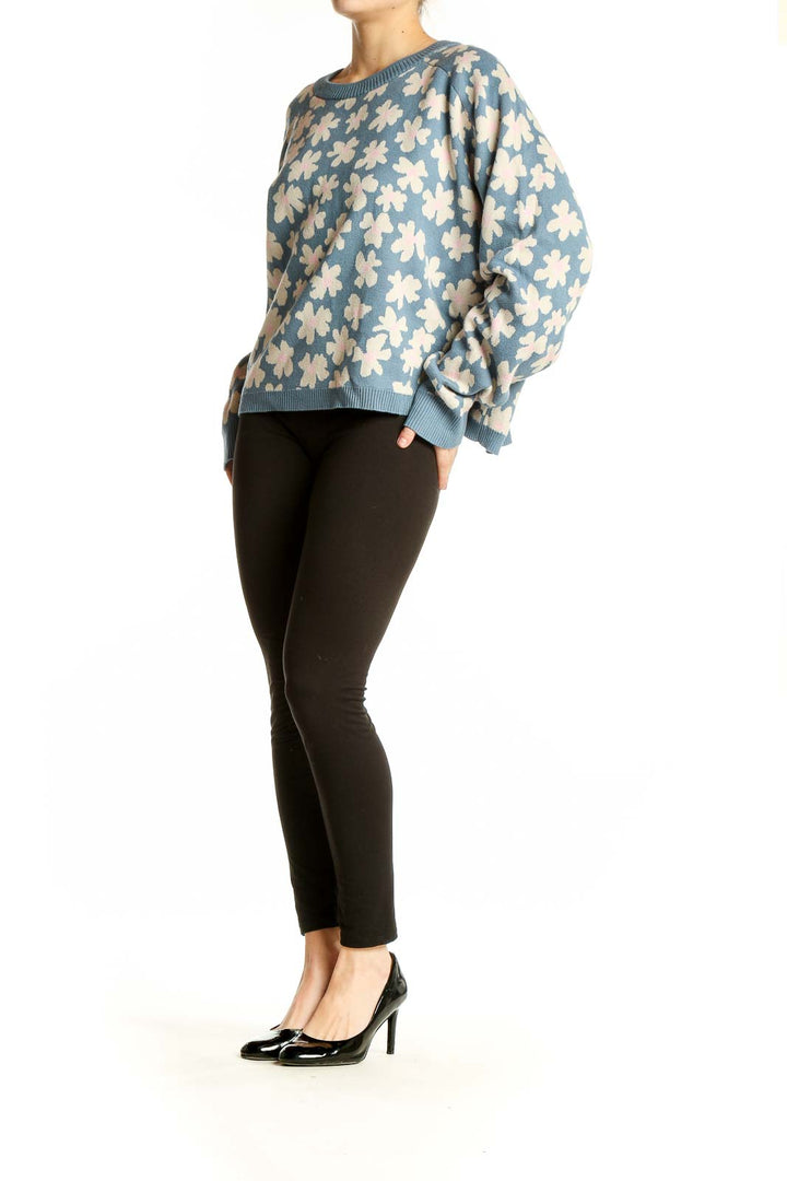 Front view of Spiritual Gangster blue floral knit sweater with cream-colored flower pattern