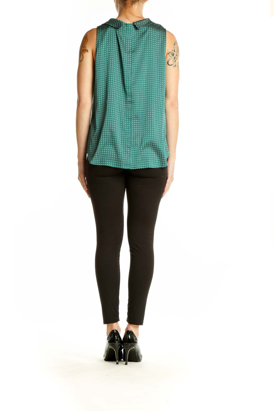 Side view of Ann Taylor green geometric print sleeveless blouse on model