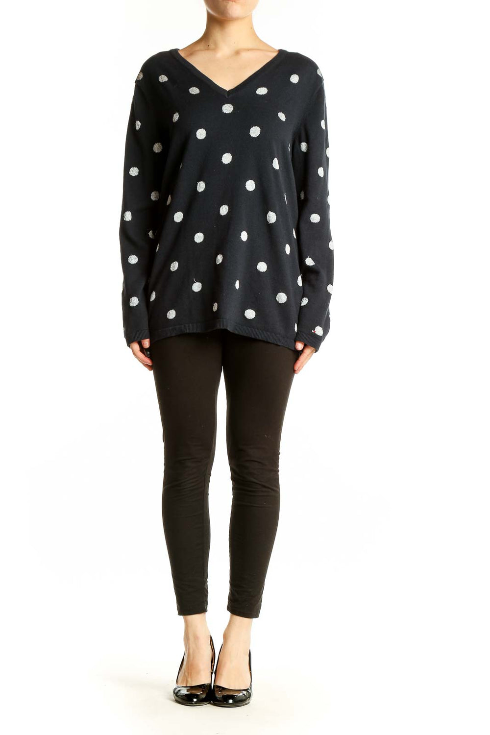 Front view of Tommy Hilfiger black V-neck sweater with white polka dots