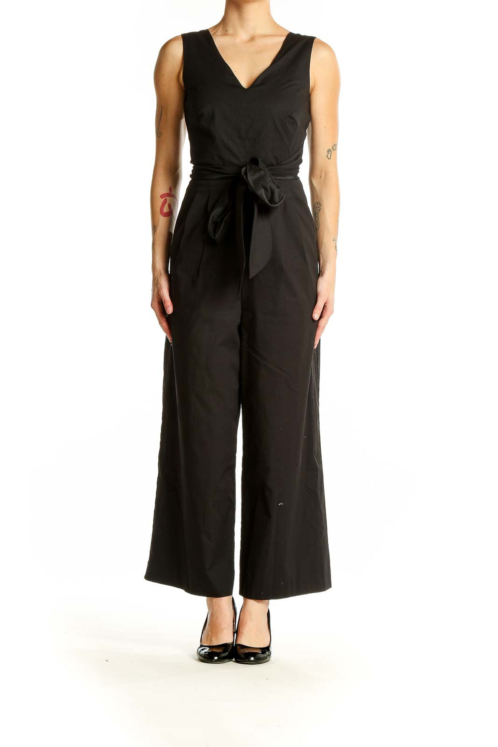 Front view of black J.Crew jumpsuit with V-neck and tie waist