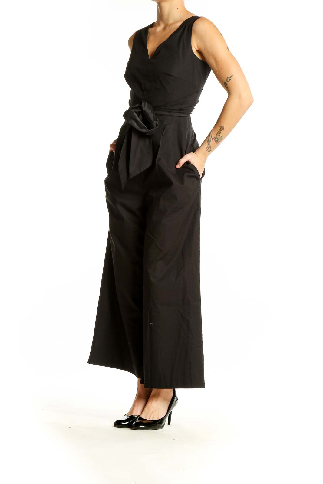 Front view of black J.Crew jumpsuit with V-neck and tie waist