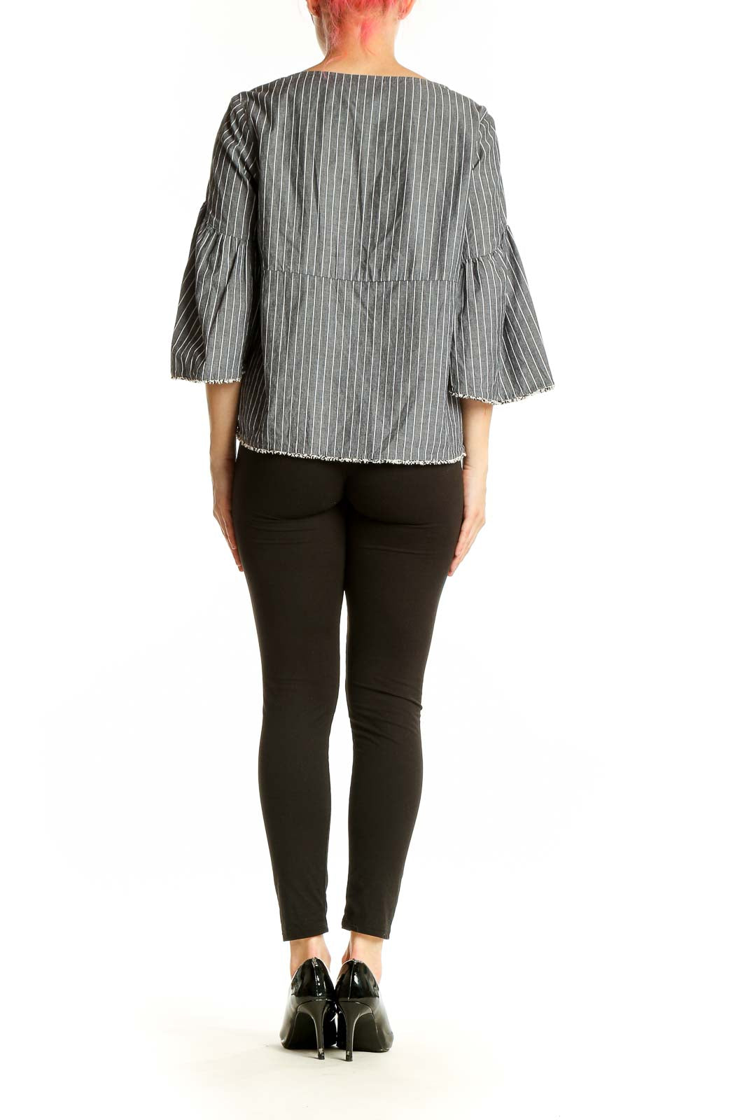 Back view of gray striped bell sleeve top with frayed hem