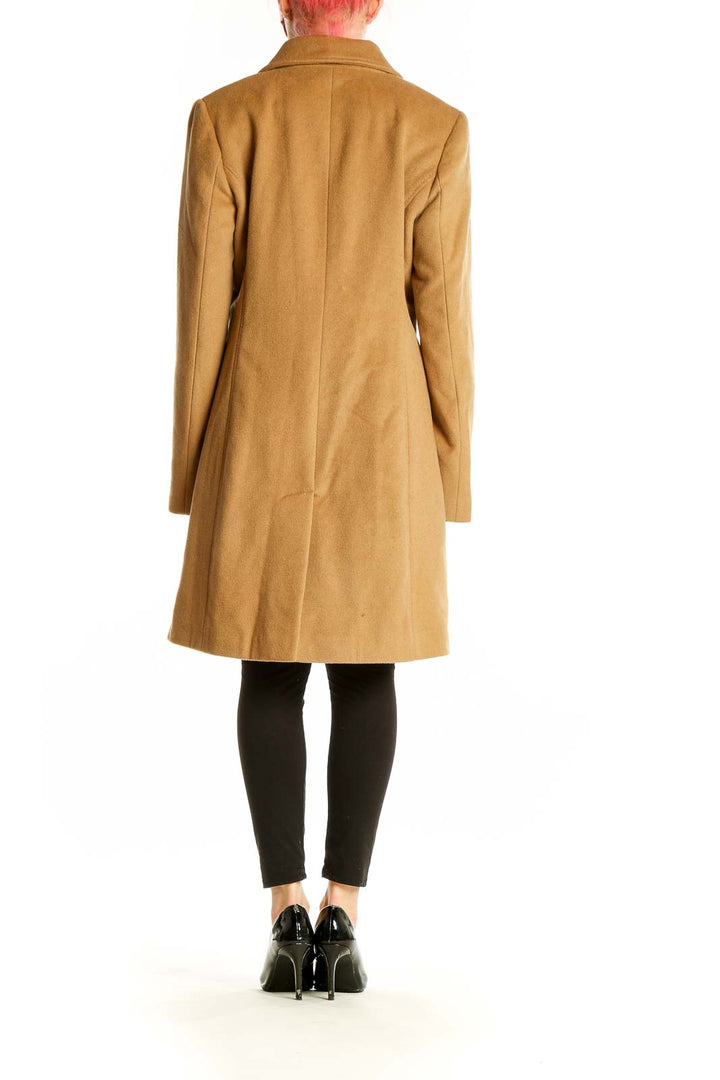 Side view of Calvin Klein camel wool blend coat showing length and fit