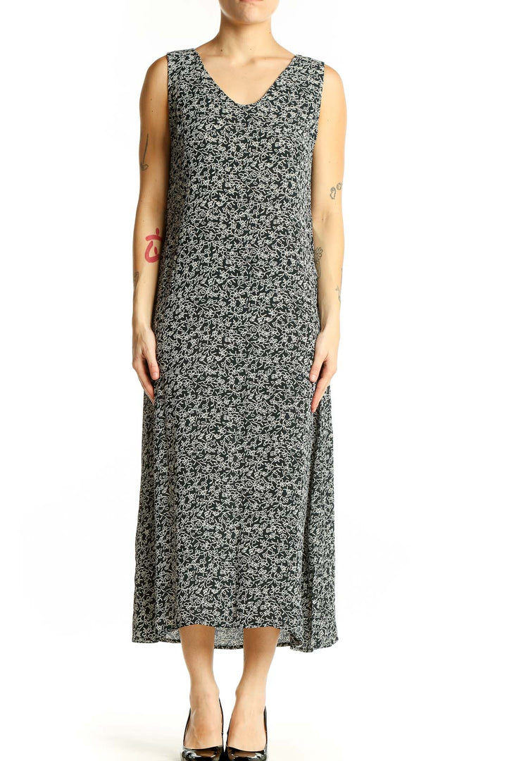 Front view of Maggy London black floral print sleeveless midi dress