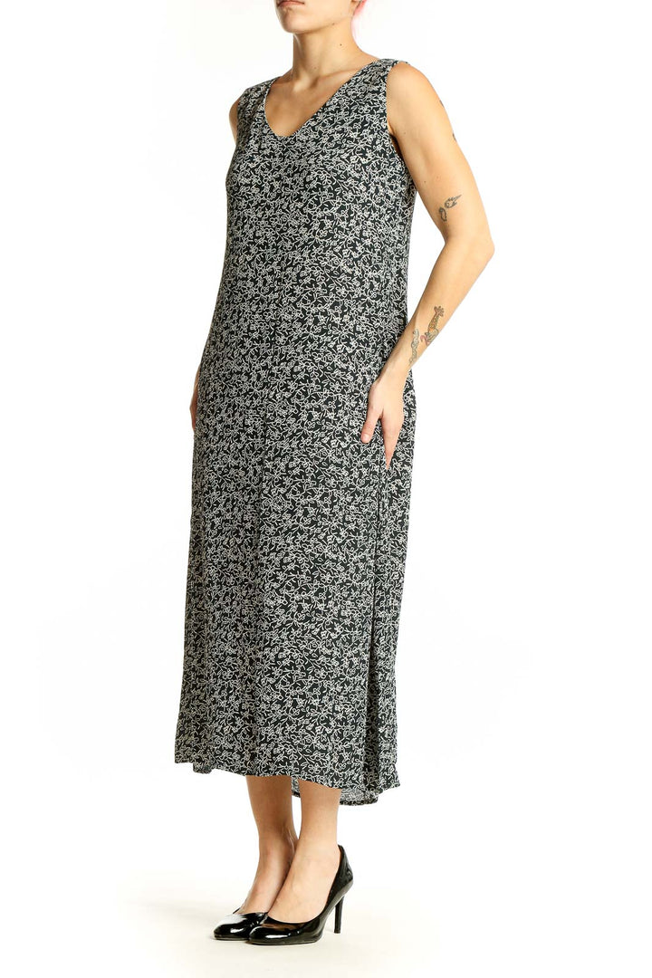 Front view of Maggy London black floral print sleeveless midi dress