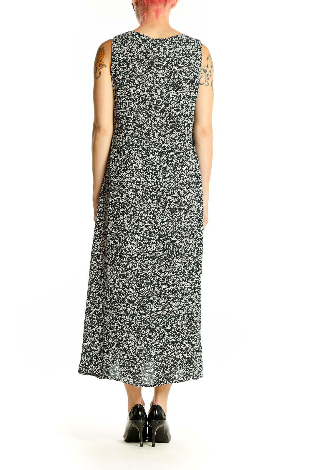 Side view of Maggy London black floral print sleeveless midi dress