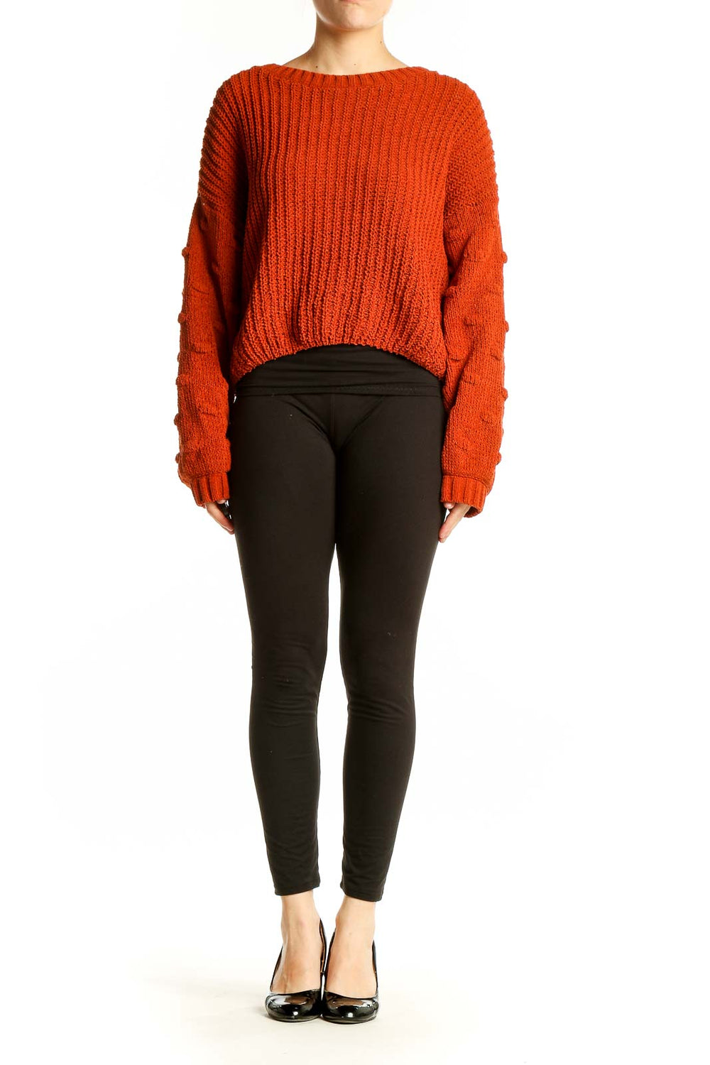 Front view of orange chunky knit cropped sweater with ribbed texture