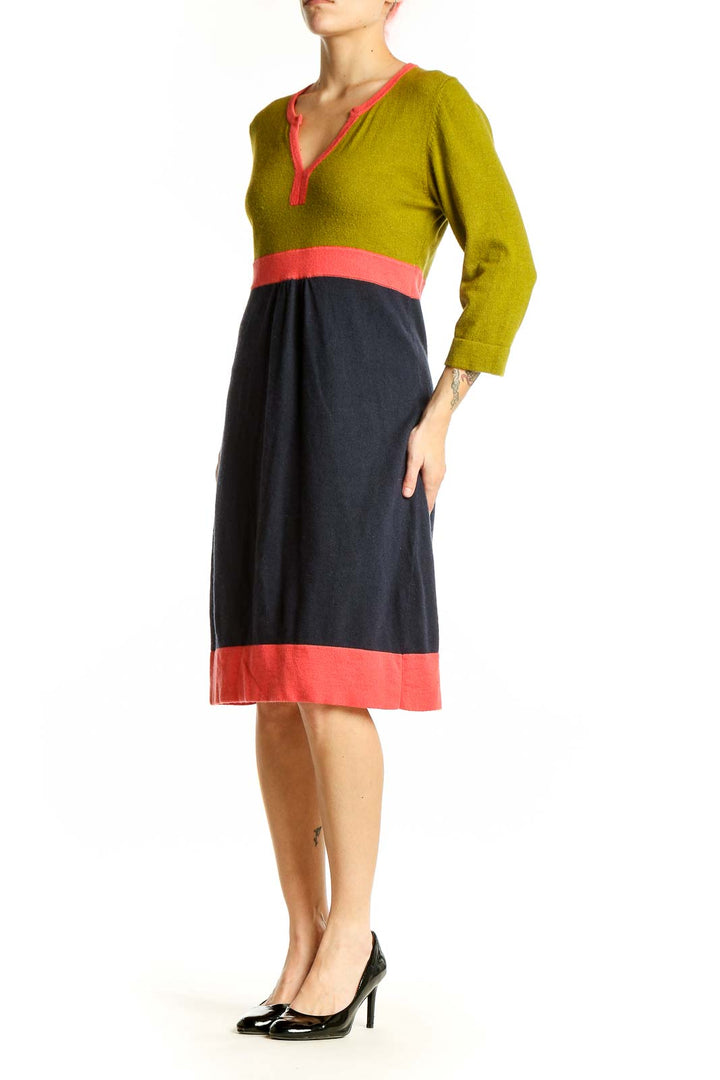 Front view of Boden color block dress with green top and navy skirt