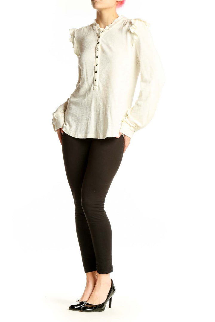 Front view of ivory Pilcro knit top with ruffled shoulders and henley neckline