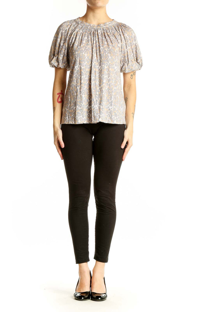 Front view of Maeve beige floral linen top with puff sleeves