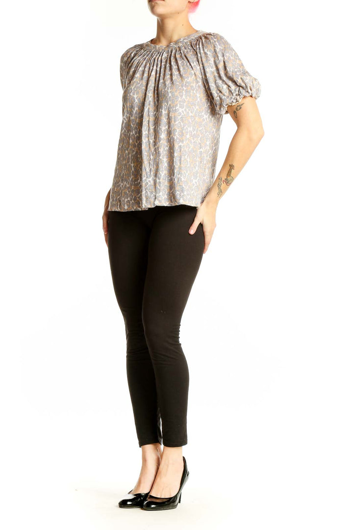 Front view of Maeve beige floral linen top with puff sleeves