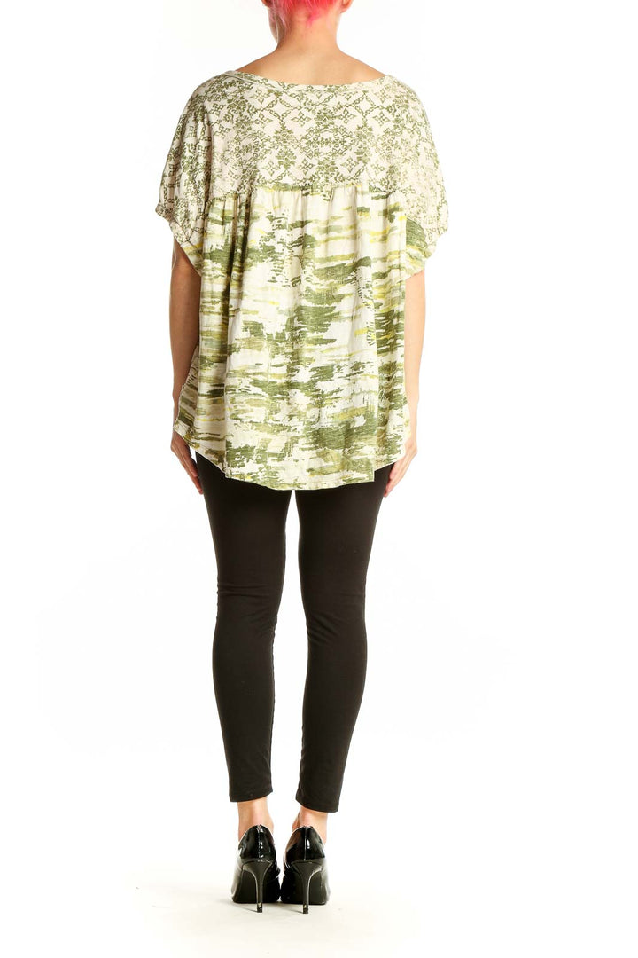 Side view of green abstract print Pilcro cotton top showing relaxed fit