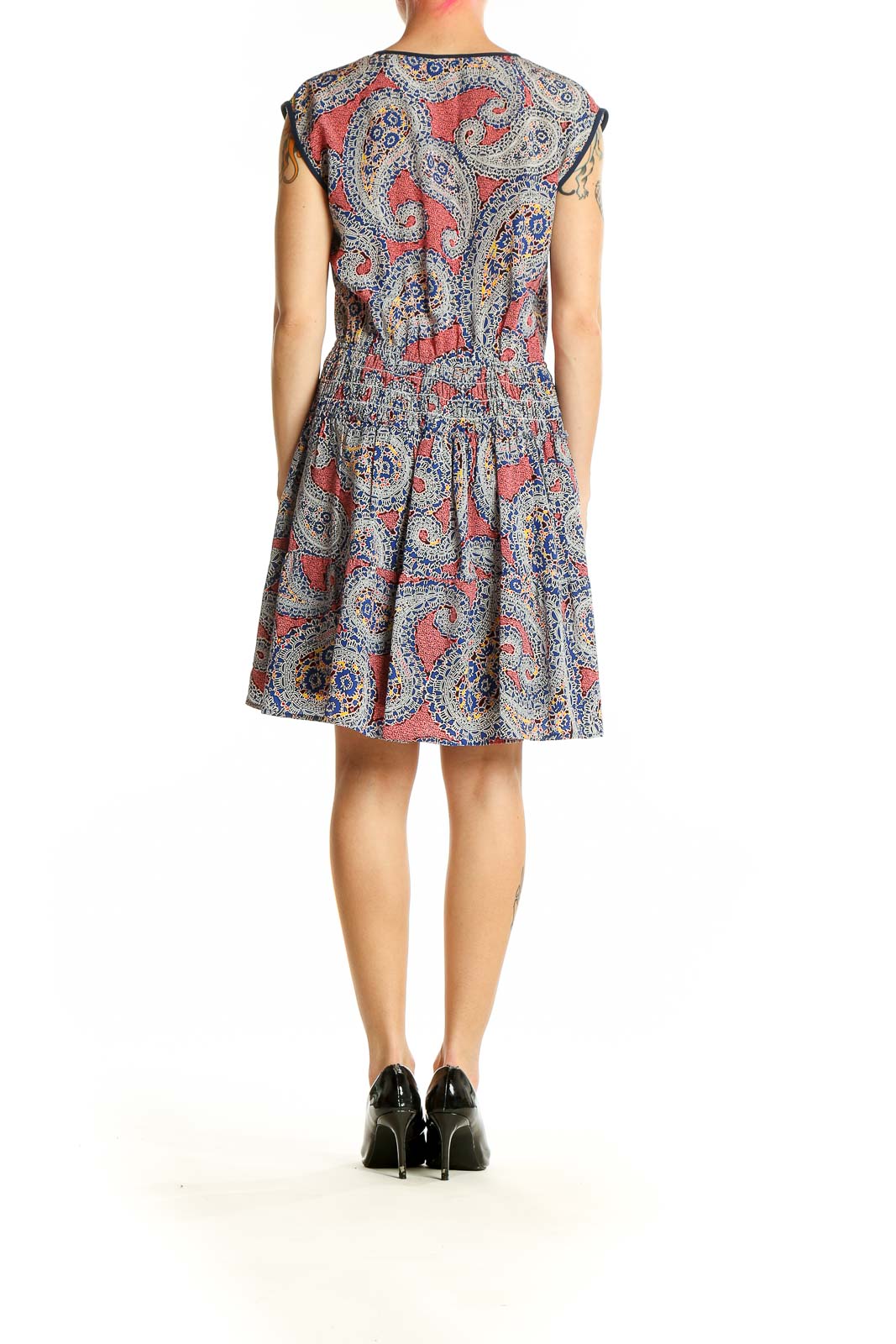 Side view of J.Crew coral paisley print sleeveless dress showing gathered waistline