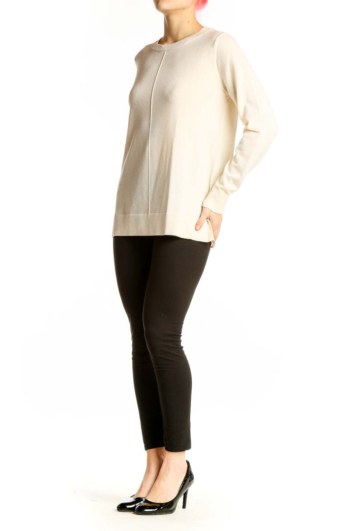 Front view of cream Merino wool crewneck sweater from Banana Republic