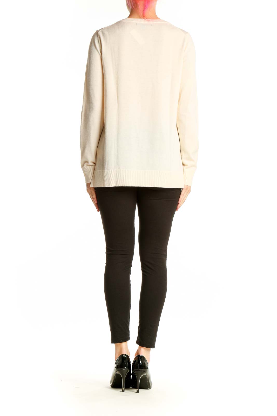 Side view of cream Merino wool crewneck sweater from Banana Republic on model
