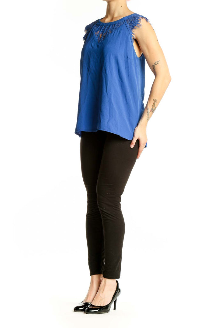 Front view of Brixon Ivy blue sleeveless blouse with lace trim
