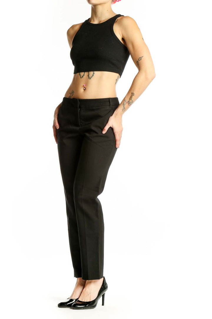 Front view of AMANDA + CHELSEA black straight-leg trousers