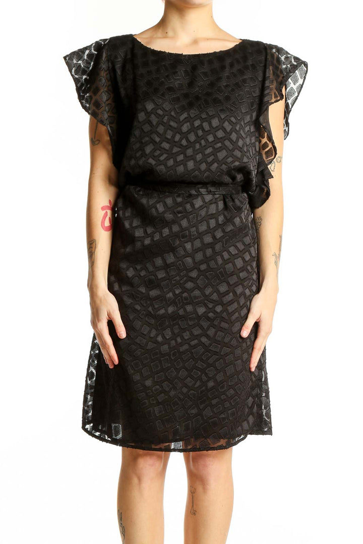 Front view of Michael Kors black geometric lace cocktail dress with flutter sleeves