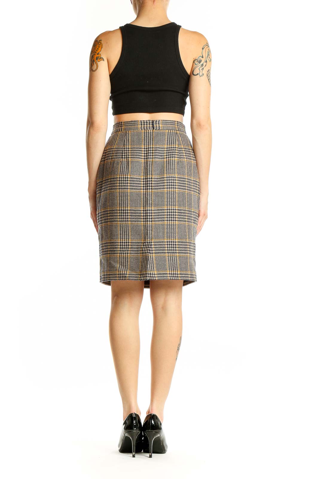 Side view of model wearing Banana Republic brown plaid wool pencil skirt with black top
