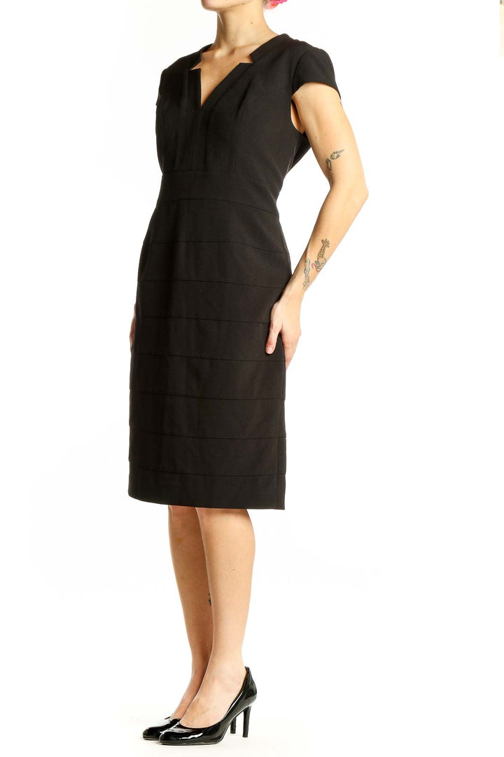 Front view of Adrianna Papell black cap sleeve sheath dress