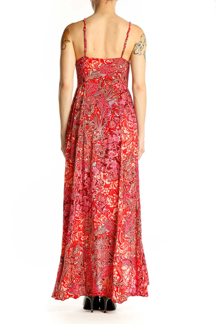 Side view of red floral maxi dress showing high-low hemline