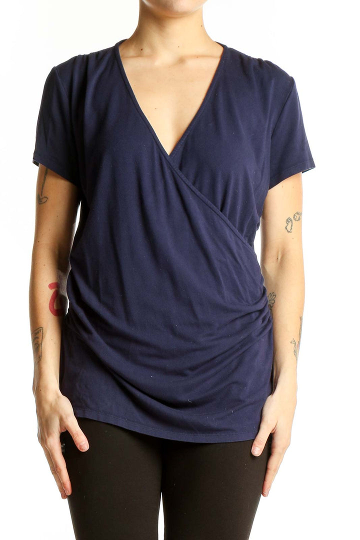 Front view of navy Boden wrap-style short sleeve top