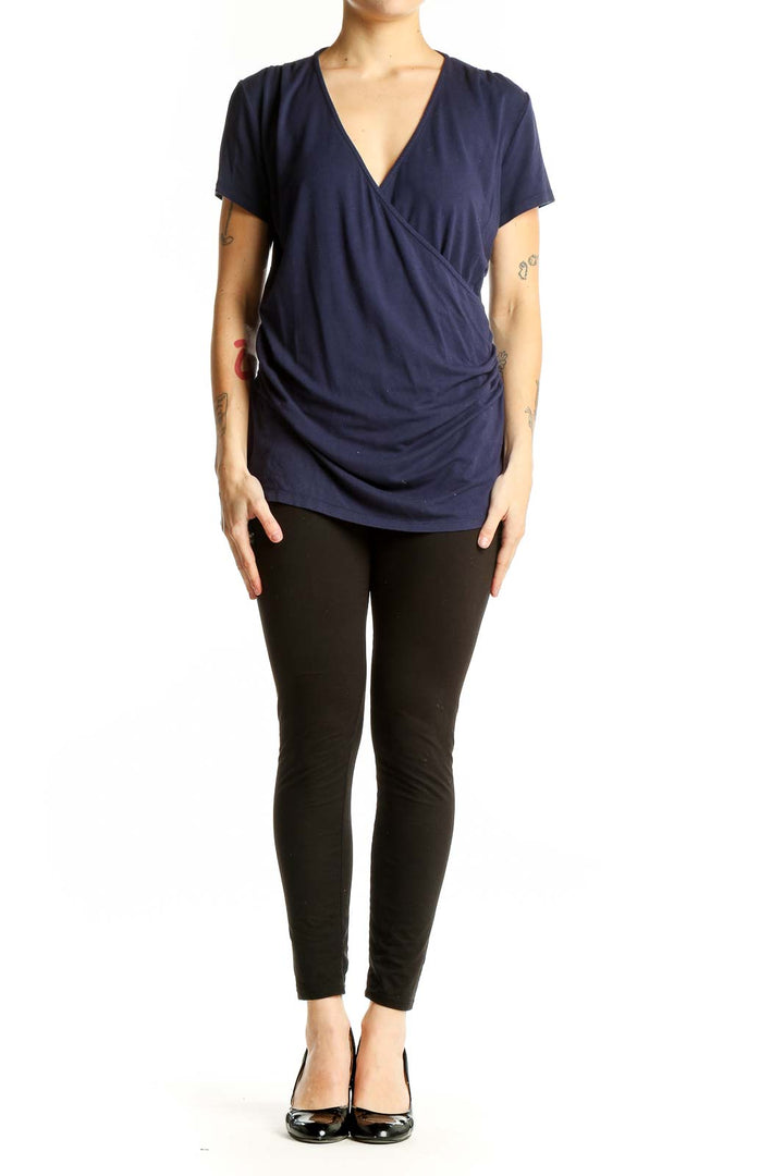 Front view of navy Boden wrap-style short sleeve top