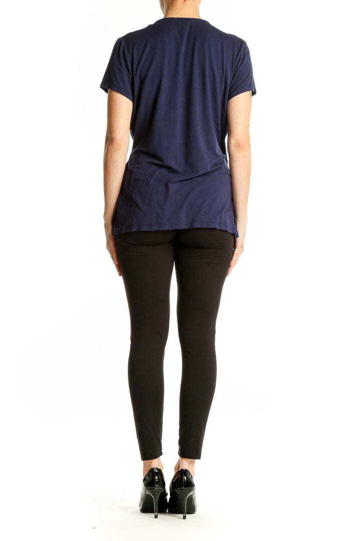 Side view of navy Boden wrap-style short sleeve top on model