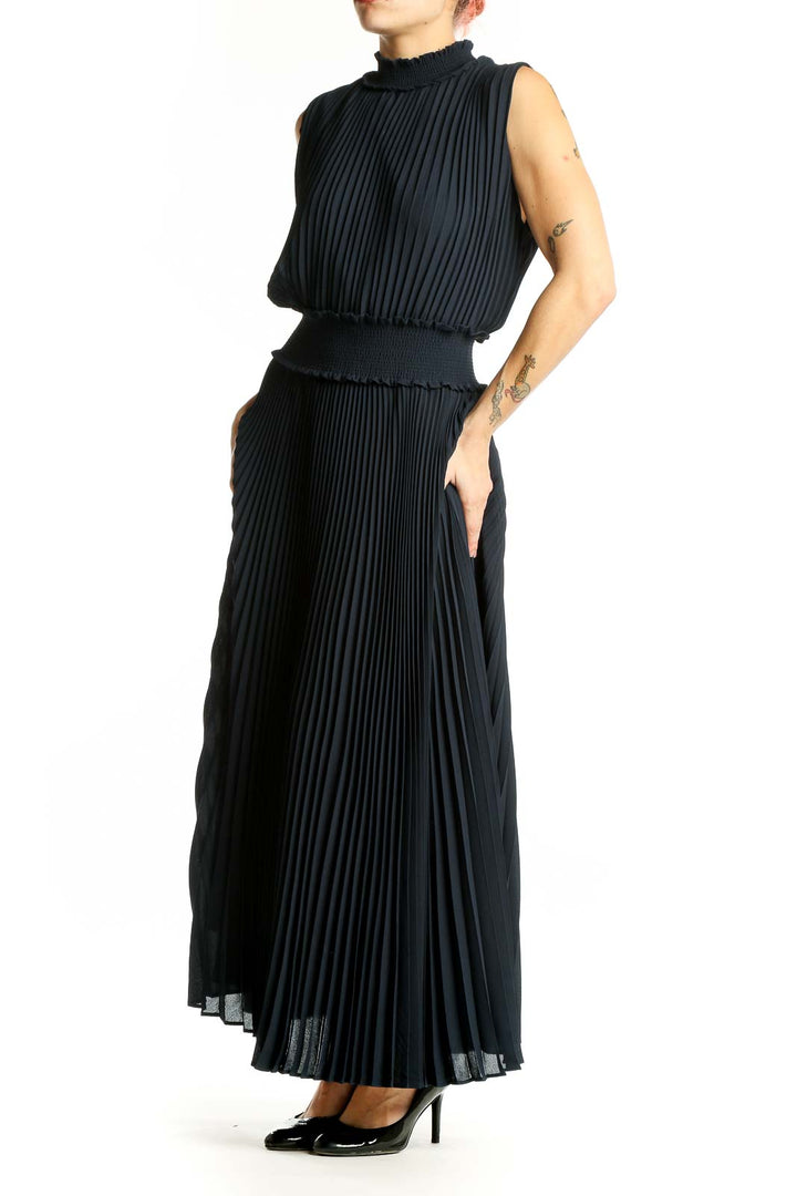 Front view of Nanette Lepore black pleated maxi dress with high neck