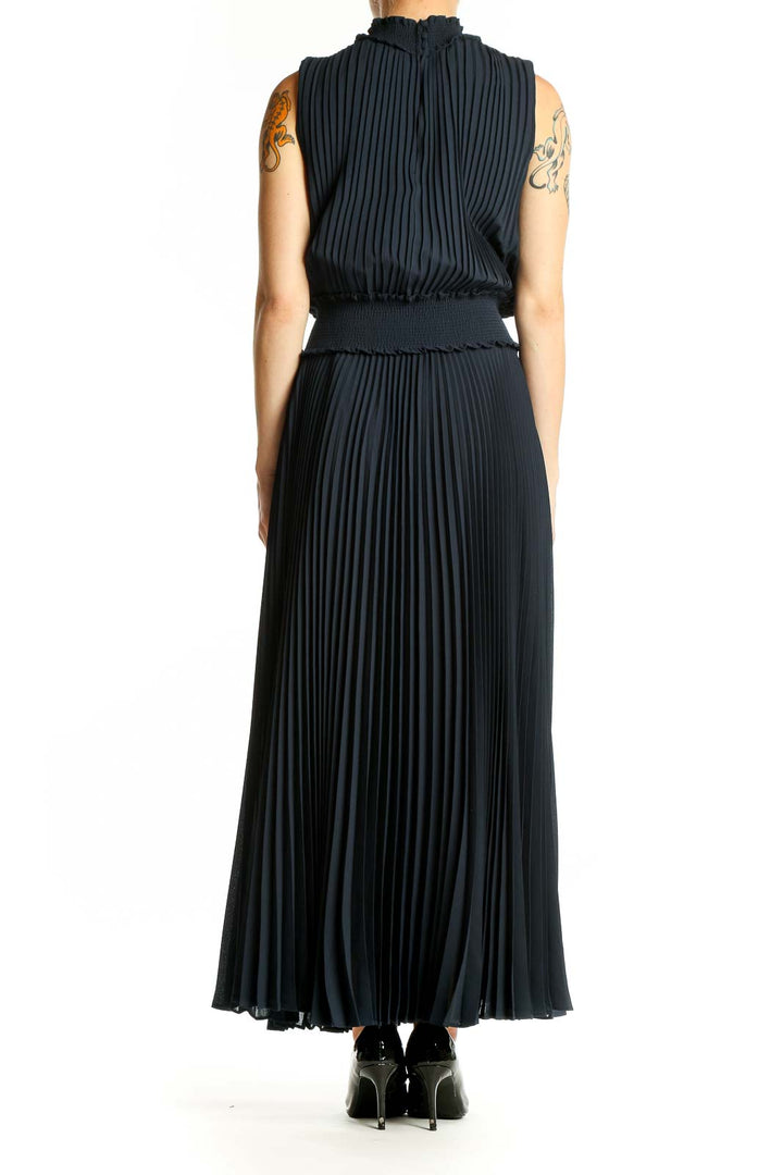 Back view of Nanette Lepore black pleated maxi dress showing full-length silhouette