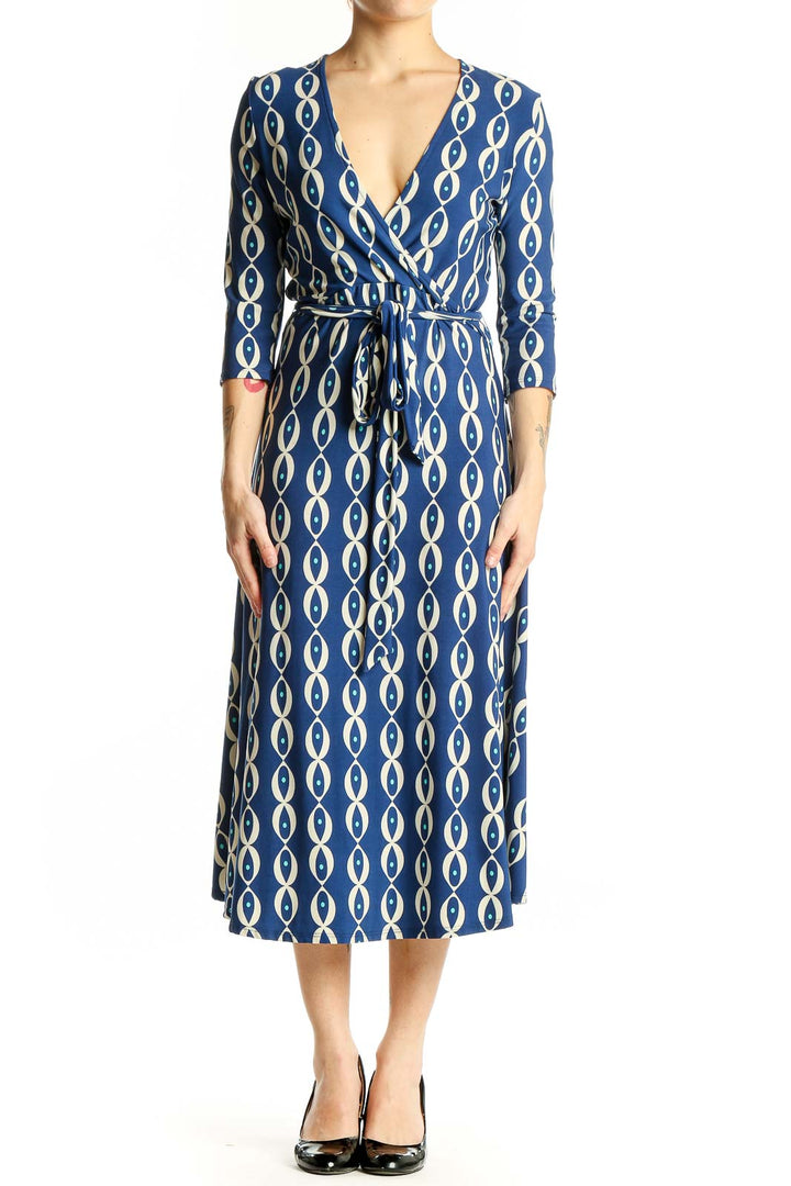 Front view of Leota blue geometric print wrap midi dress