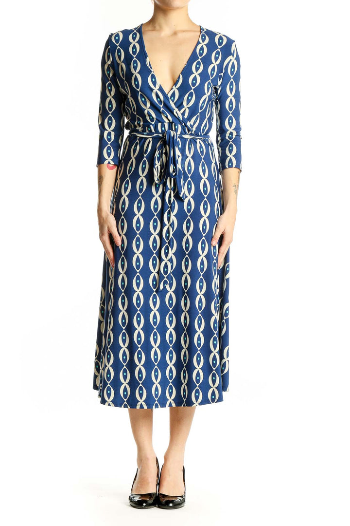 Front view of Leota blue geometric print wrap midi dress