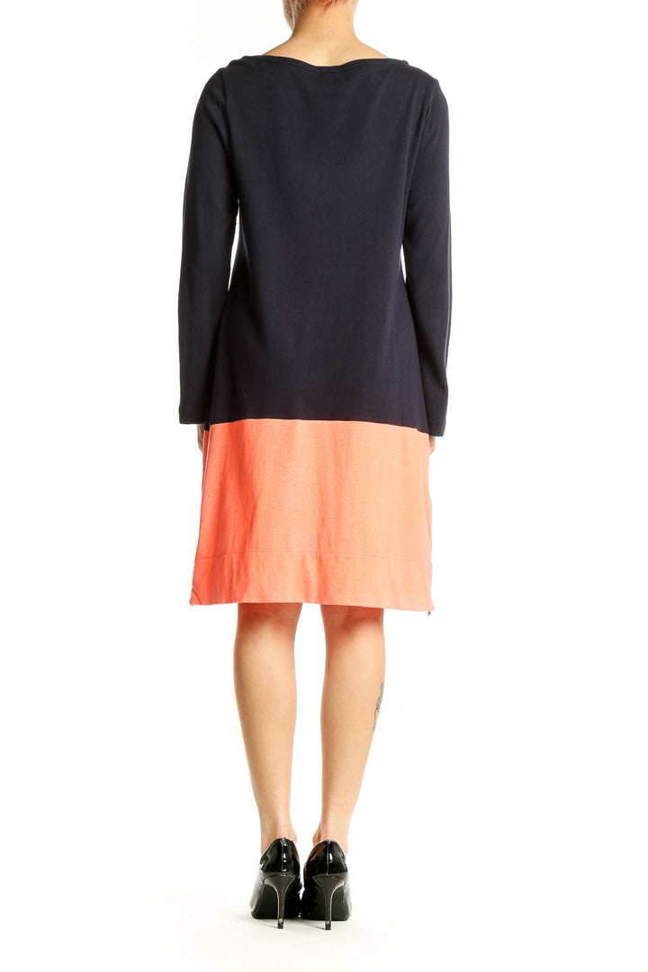 Side view of J.Crew black and coral color block cotton dress
