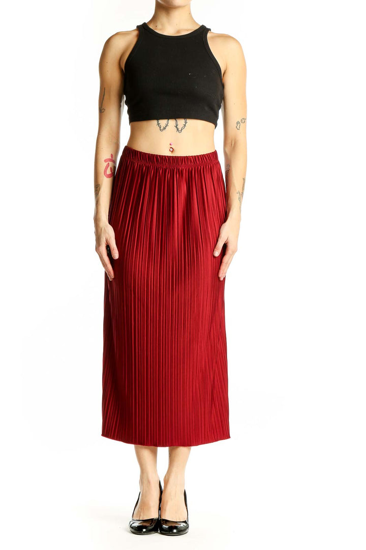Front view of red pleated midi skirt from Zara