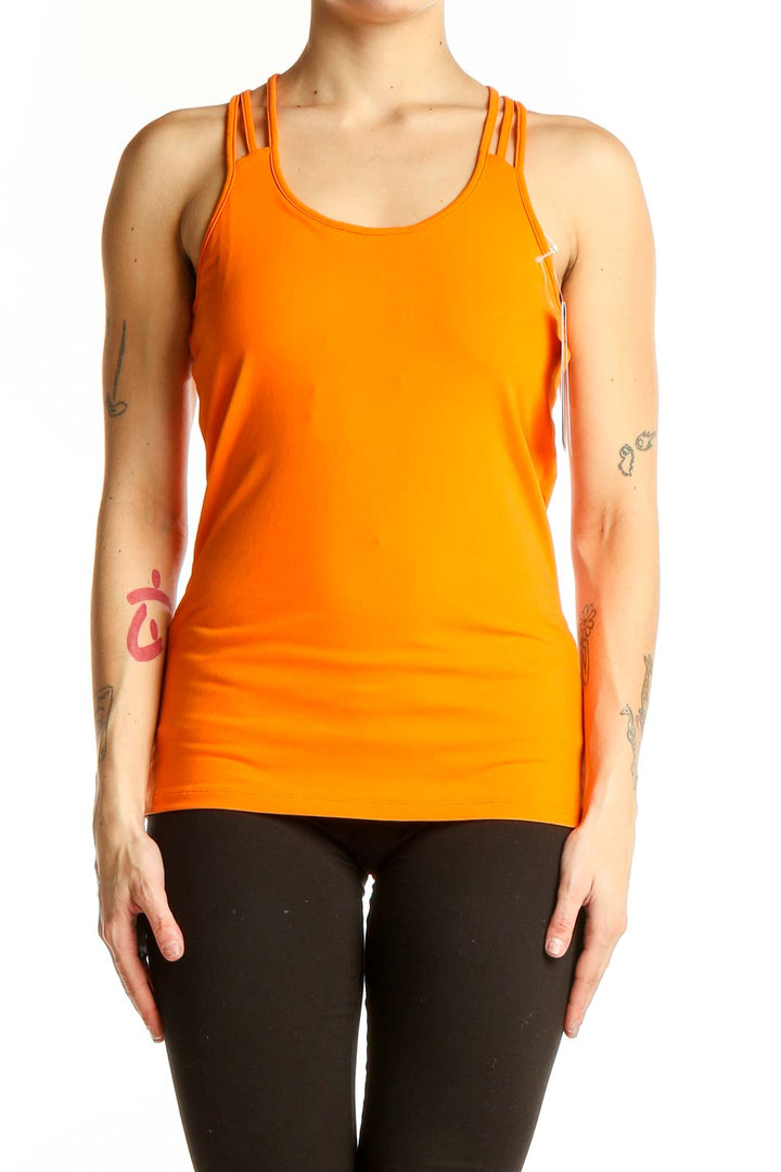 Front view of orange Marmot athletic tank top with strappy racerback design